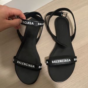 Balenciaga women’s black leather logo sandals